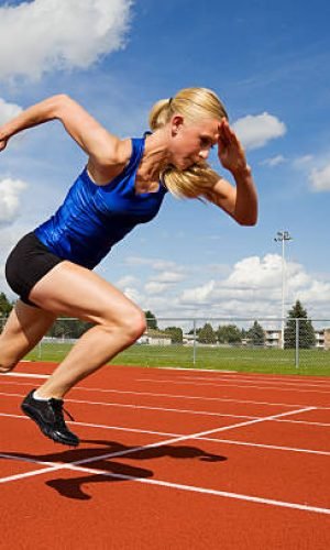 Track athlete exploding out of the starting blocks